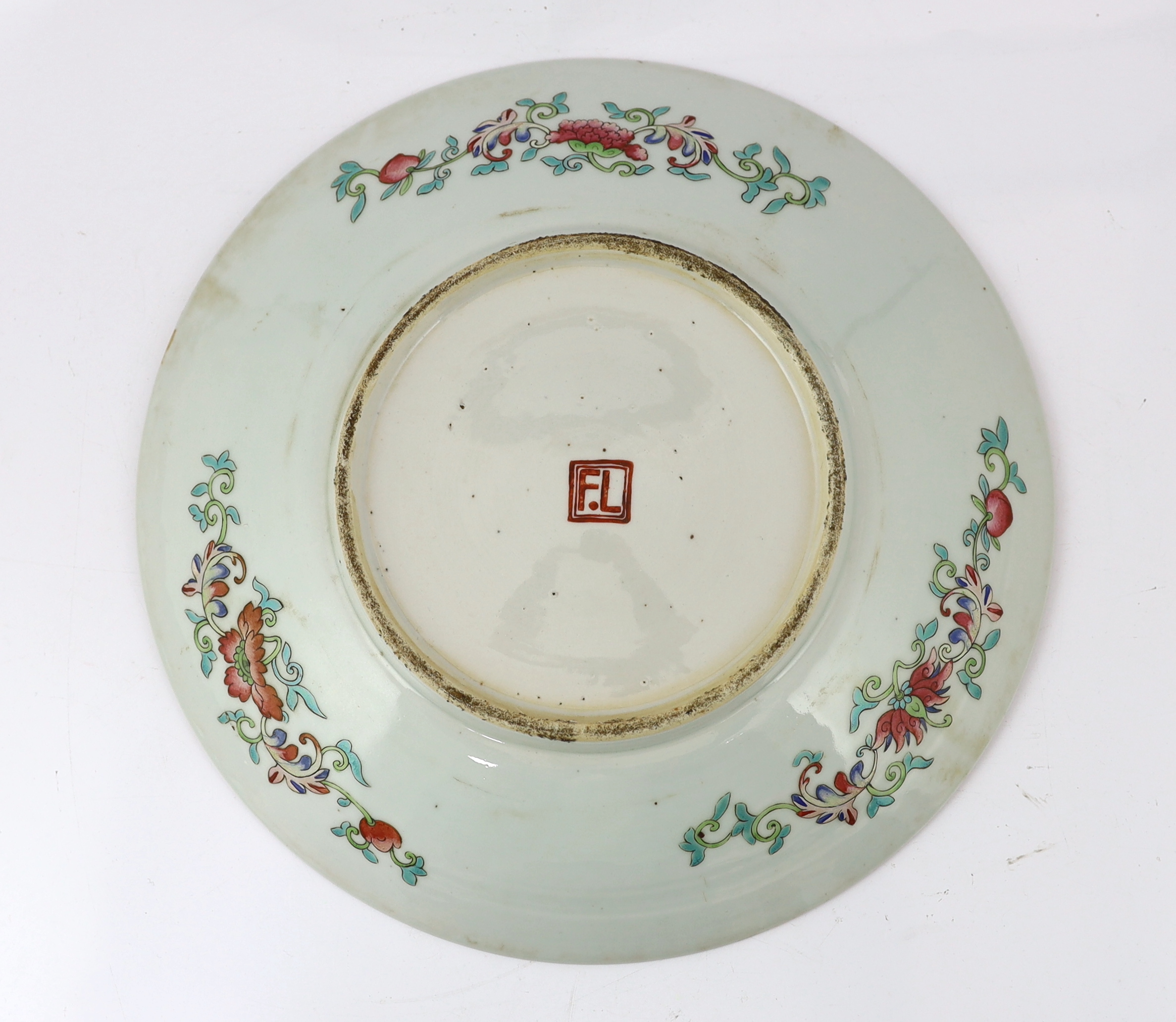 A Chinese yellow ground famille rose dish, late 19th century, with unusual Western script ‘F.L’ seal mark